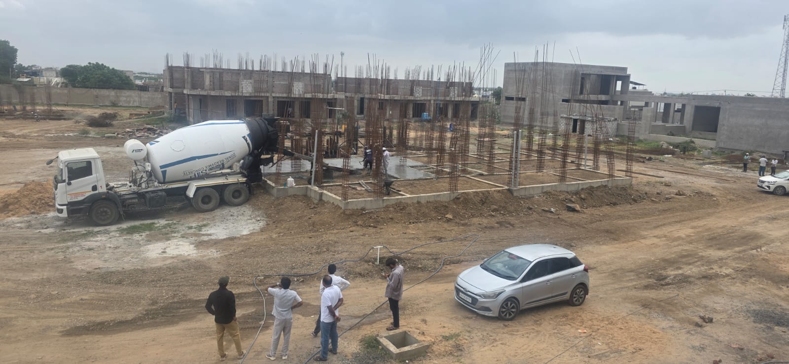 Ready-mix concrete being discharged at a reinforced site